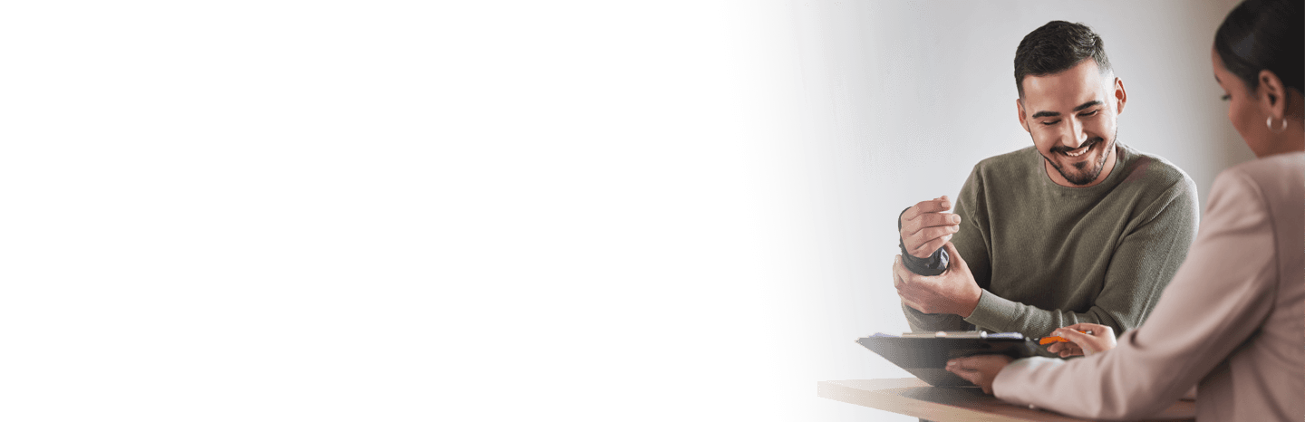 Female lawyer working with a male client on their injury case